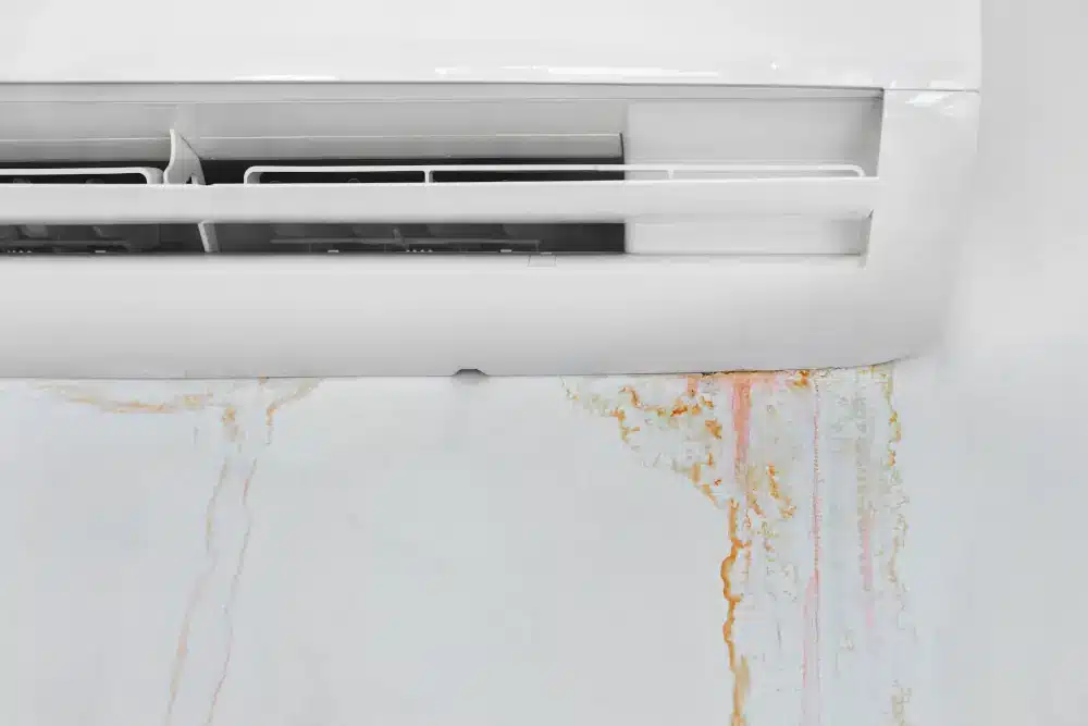 Affects of Humidity on Your AC - AC with rust stains on wall from leaking water